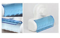 Modern wall-mounted toothbrush holder with protective blue wavy design
