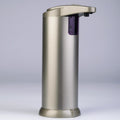 Silver soap dispenser on a light gray background