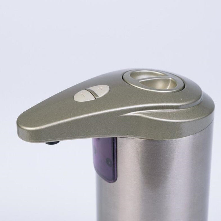 Silver and stainless steel dispenser on a light gray background