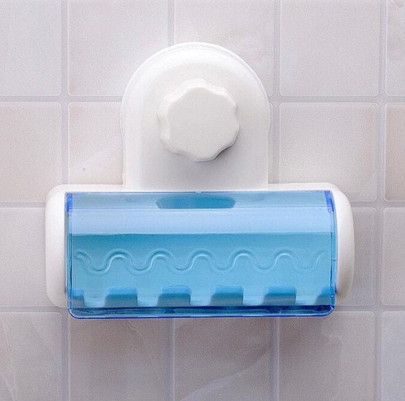 Wall-mounted toothbrush holder suctions to tiled wall