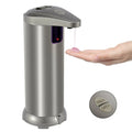 Silver automatic soap dispenser dispensing soap onto a hand
