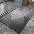 Geometric-patterned gray bathmat on a stone floor
