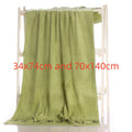 Green towel draped over a rack with dimensions displayed