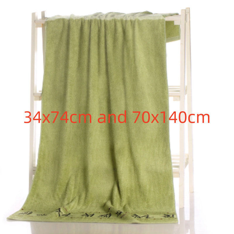 Green towel draped over a rack with dimensions displayed