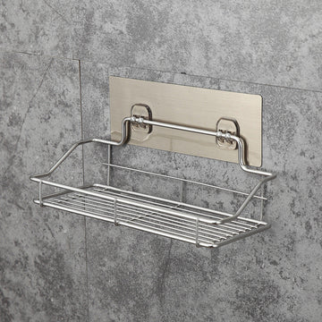 Metal wall-mounted shelf attached to a gray tiled wall