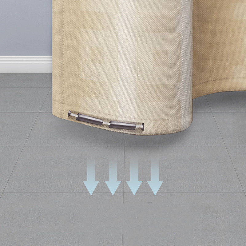 Yellow Golden curtain with a rod on a gray floor