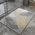 Decorative bathmat with leaf patterns on a stone floor
