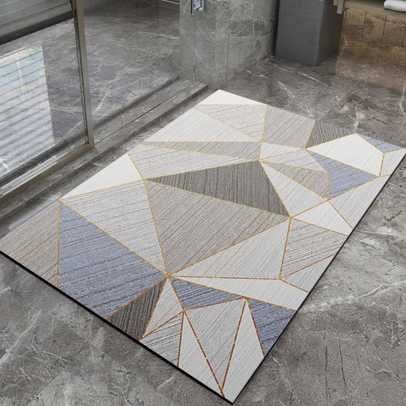 Geometric patterned bathmat on a stone floor